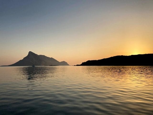 Cala Girgolu With Island View Tavolara At Sunset